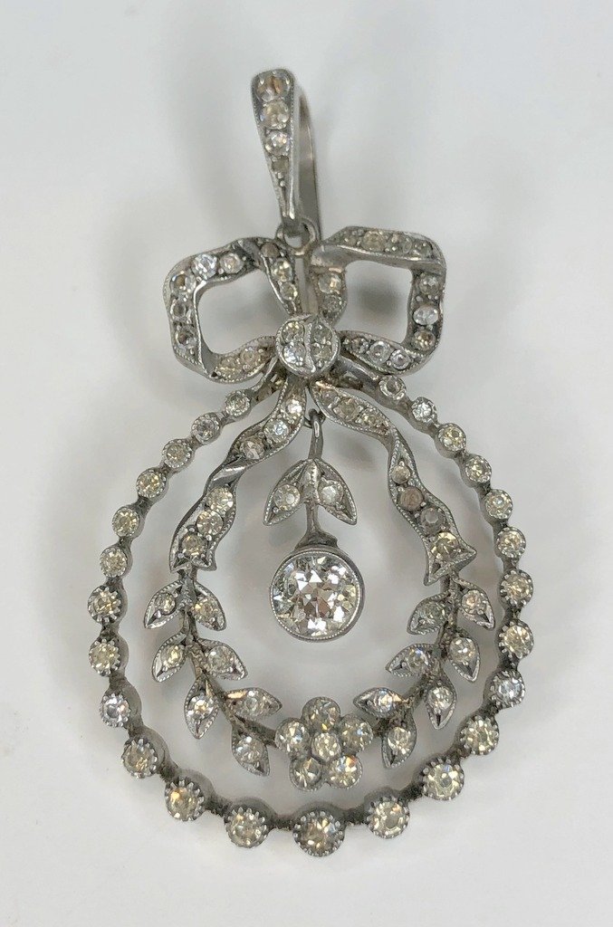 Silver,.50ct diamond and paste Edwardian style pendant: Silver,.50ct diamond and paste Edwardian style pendant. 5.65dwt, length:1.75 inches.The item is all silver with paste stones, the one diamond is the largest in the center(the swinging diamond).Davids