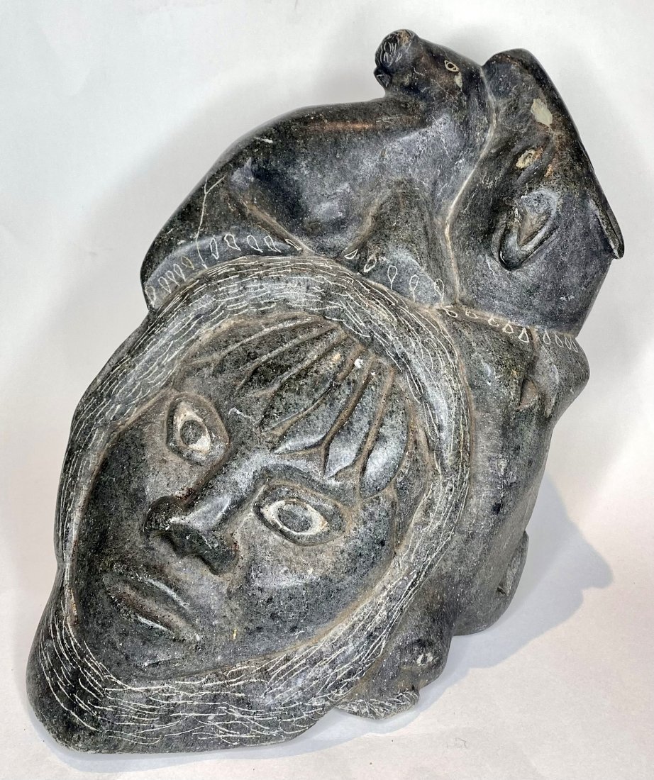 Stone sculpture of Inuit face and animals: Stone sculpture of Inuit face and animals H: 10 1/4" x W: 9" x D: 7" Davids notes: This came out of storage unit in Ossining NY, that belonged to Dr. Gregory Siskind.