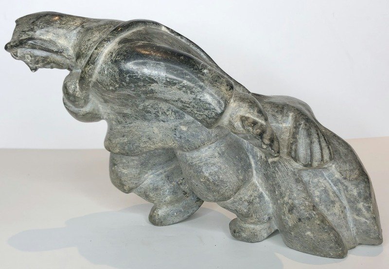 Stone sculpture of Inuit pulling seal: Stone sculpture of Inuit pulling seal 10" long x 7" tall Davids notes: This came out of storage unit in Ossining NY, that belonged to Dr. Gregory Siskind.