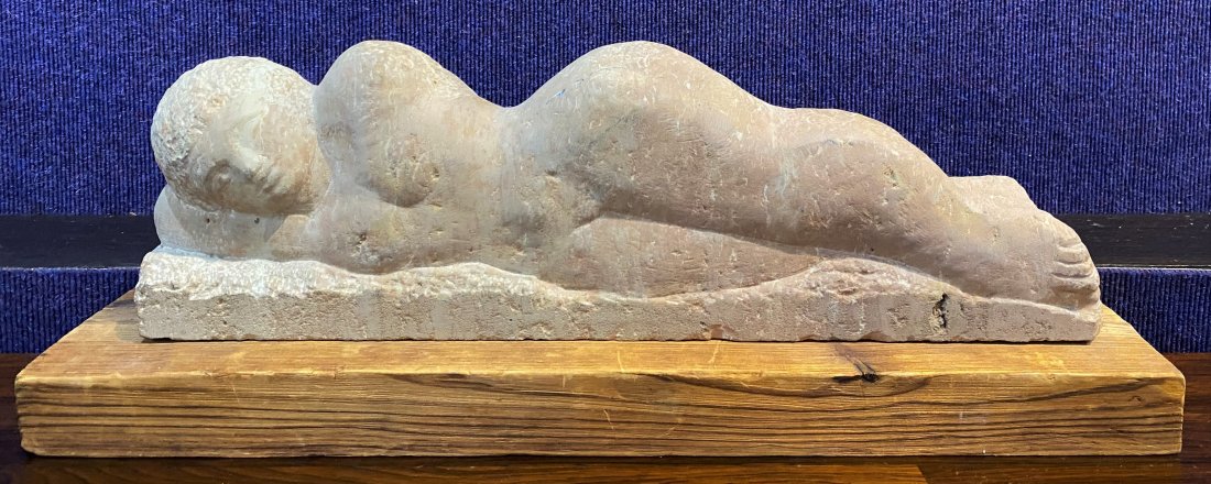 Unsigned stone sculpture, reclining nude: Unsigned stone sculpture, reclining nude The dimensions of the stone sculpture are: 9"L x 6"W x 7.5"H The wooden base is: 22.25"L x 5.5"W x 2"H