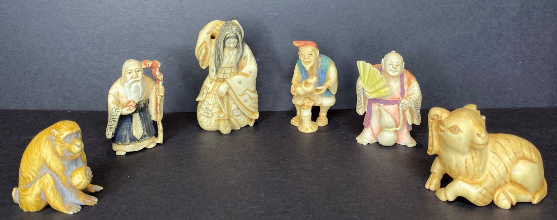 Six netsukes: Six netsukes, all signed Fukurokuju (God of Longevity), signed Tomonobu: 1 7/8 inches tall Rotating-face witch: 2 1/2 inches tall Man holding fan and gourd: 2 inches tall Man with baby: 2 inches tall 