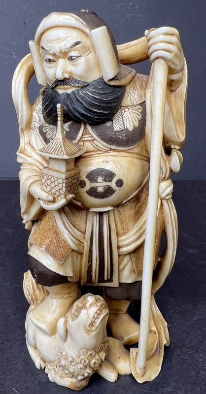 Japanese carving by Kogetsu, Tamonten, c1880: Japanese carving by Kogetsu, Tamonten, c1880 Height: 5.5" Tamonten God (Source: Wiki) In Japan, Bishamonten, or just Bishamon is thought of as an armor-clad god of war or warriors and a punisher of ev