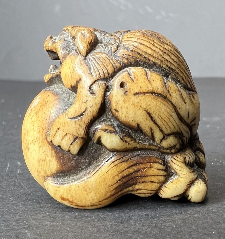 Japanese netsuke: Mythical creature and ball (1 of 6)