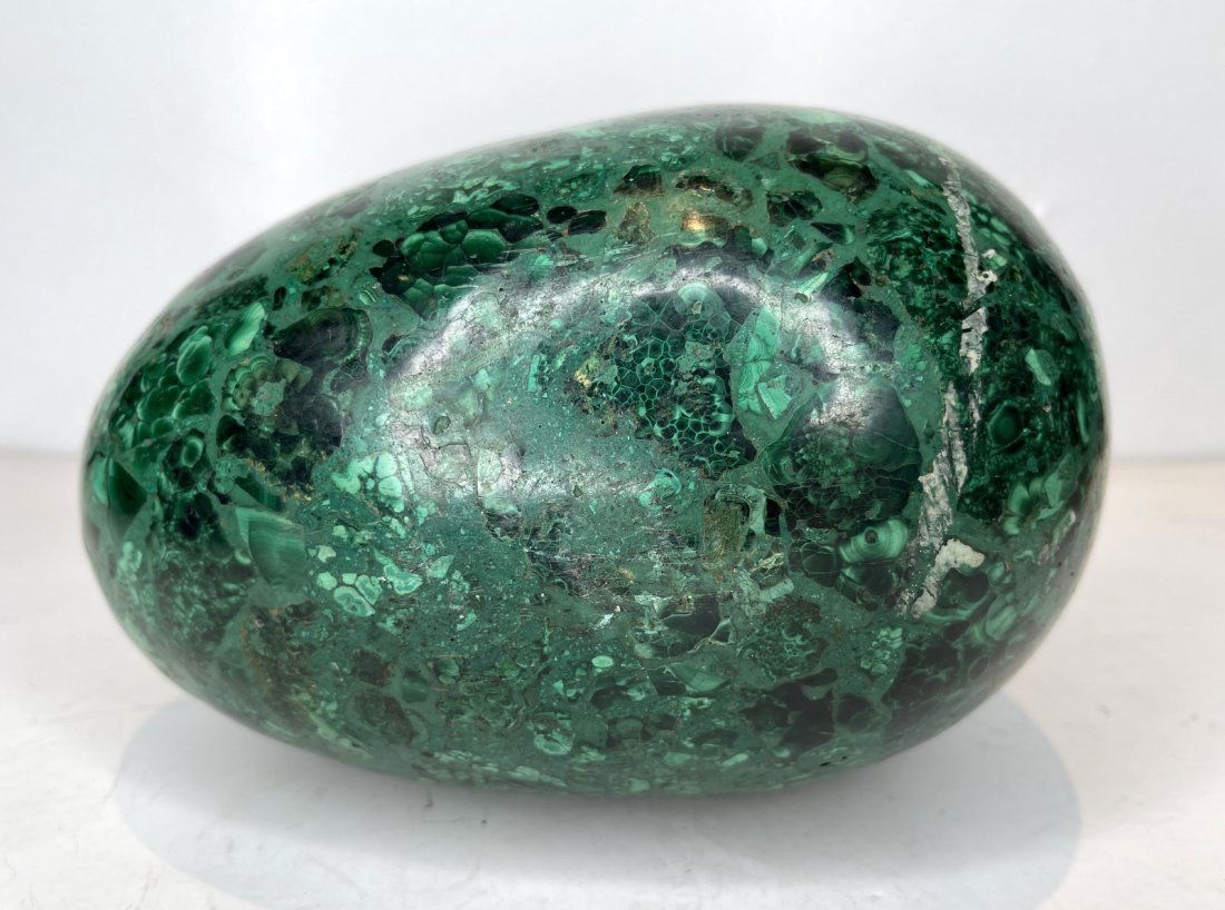 Malachite egg: Malachite egg8.5"H ProvenanceEstate of Dr David Y Solomon, of NYC, heart surgeon and avid collector of rare French, Middle Eastern and African antiques as well as Fine Art, Antiquities and furniture.