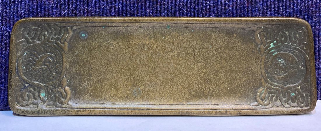Tiffany Studios gilt bronze zodiac pen tray,c1915: Tiffany Studios gilt bronze zodiac pen tray 9.25" x 3".C1915.Some wear to the surface, gilding gone.Polish residue.