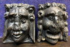 Pair of carved wood lion faces