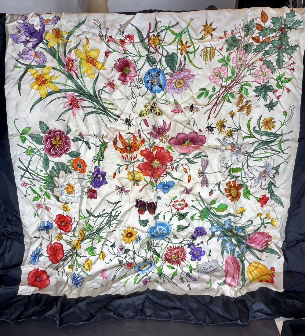 Gucci silk scarf: Gucci silk scarf by Vittorio Accornero, 33" x 33.5"The scarf is crinkled and stiff; it likely needs to be taken to a dry cleaners to make it soft again.