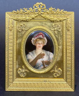 Enamel painting of maiden, gilt metal frame: Enamel painting of maiden, gilt metal frameFrame: 5.25" x 7"Oval plaque (sight to frame): 2.25" x 3"The enamel painting is based off the work of 19th century German artist Georg Hom.