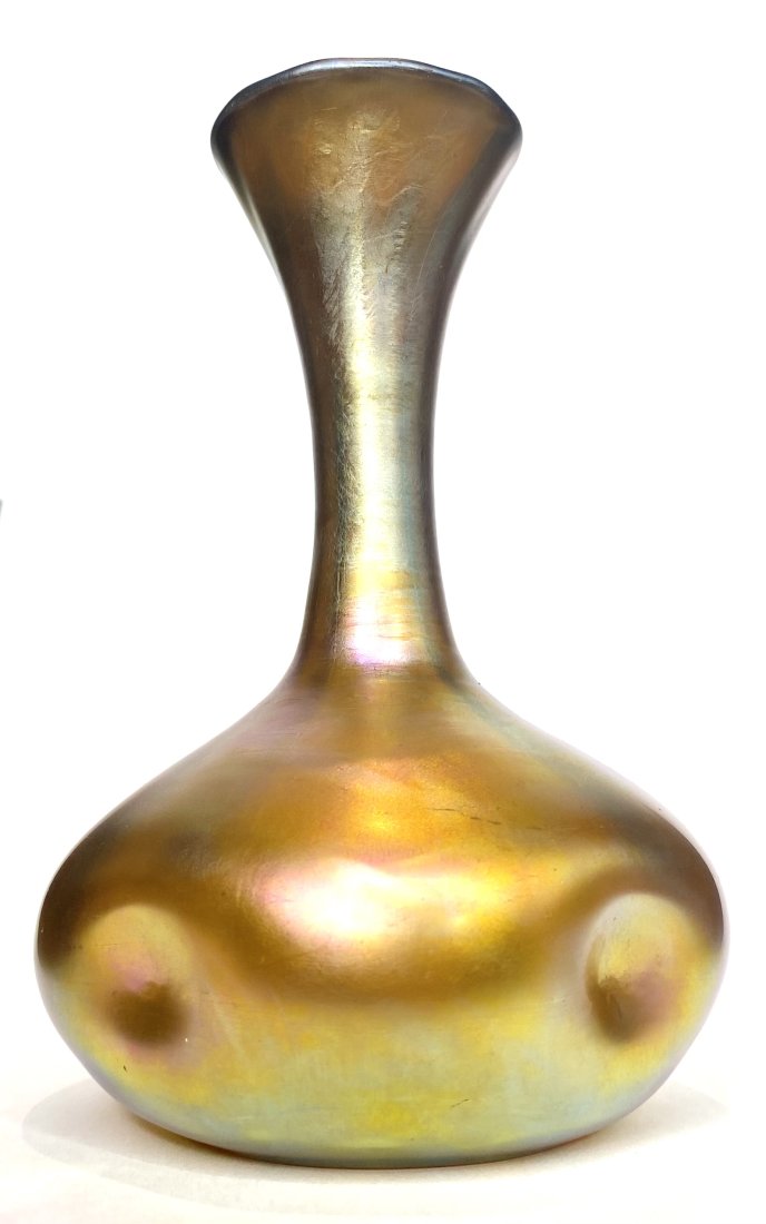Steuben Aurene art glass vase: Steuben Aurene art glass vaseHeight: 5.25"Aurene is a type of ornamental glass with an iridescent surface made by spraying the glass with stannous chloride or lead chloride and reheating it under cont