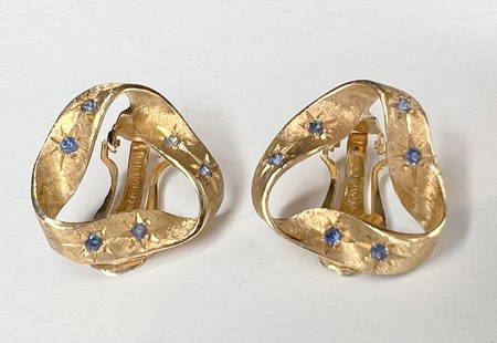 14k and sapphire ear clips, 5 dwts: 14k and sapphire ear clips, 5 dwts 7/8 inch acrossEach earring has six natural sapphires and florentine engraving.