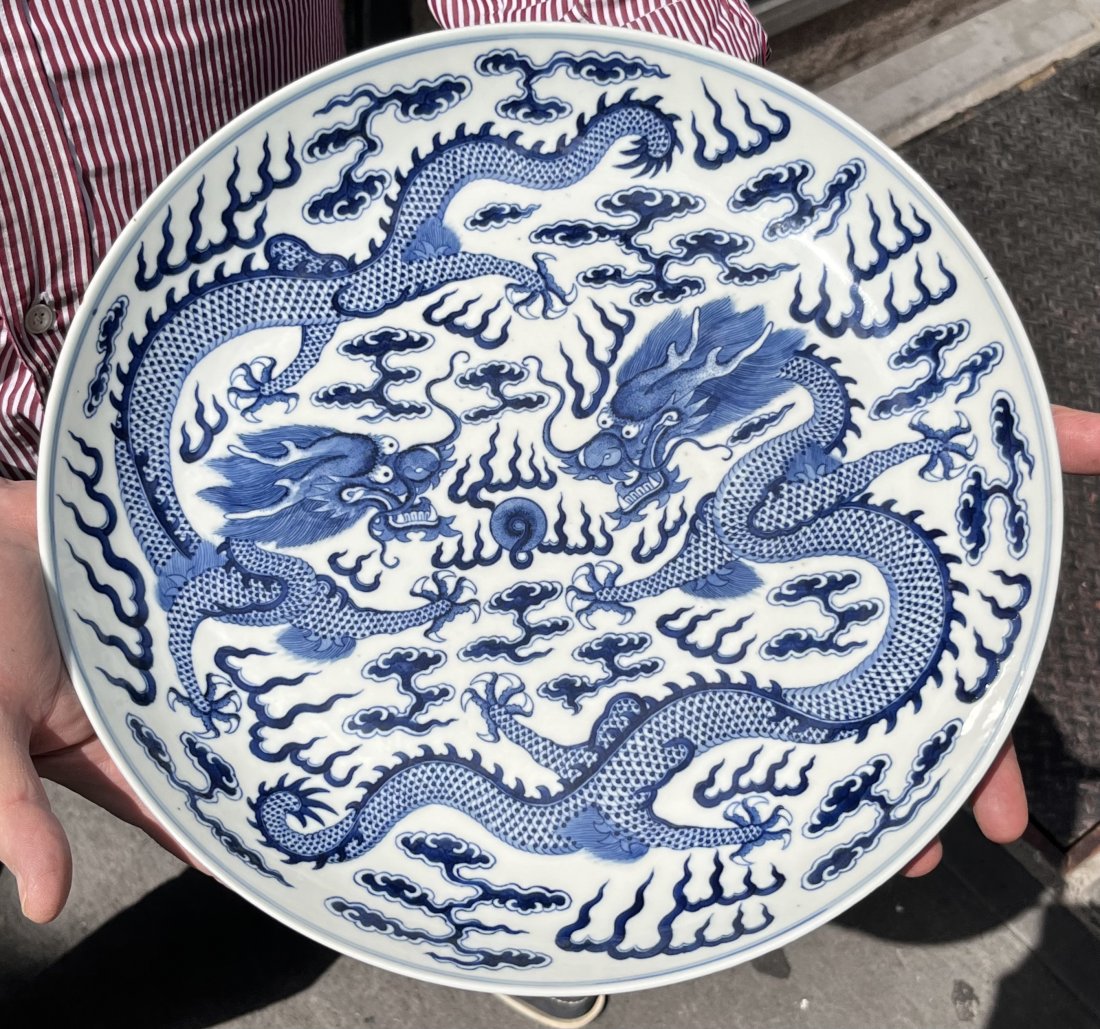 19thc Chinese blue & white dragon plate-Sotheby Provenance: 19thc Chinese blue & white dragon plate, Sothebys Provenance Guanxu Reign (Qing Dynasty) marks Diameter: 13.5" Davids notes: The round brown sticker on the piece with the black initials SPB refer to t