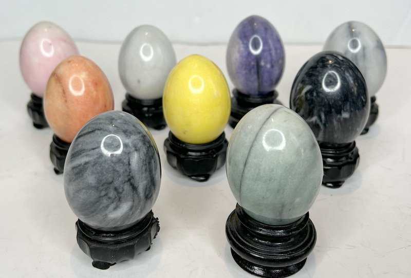 Group of nine marble eggs with wood stands: Group of nine marble eggs with wood stands Eggs: 2.5"
