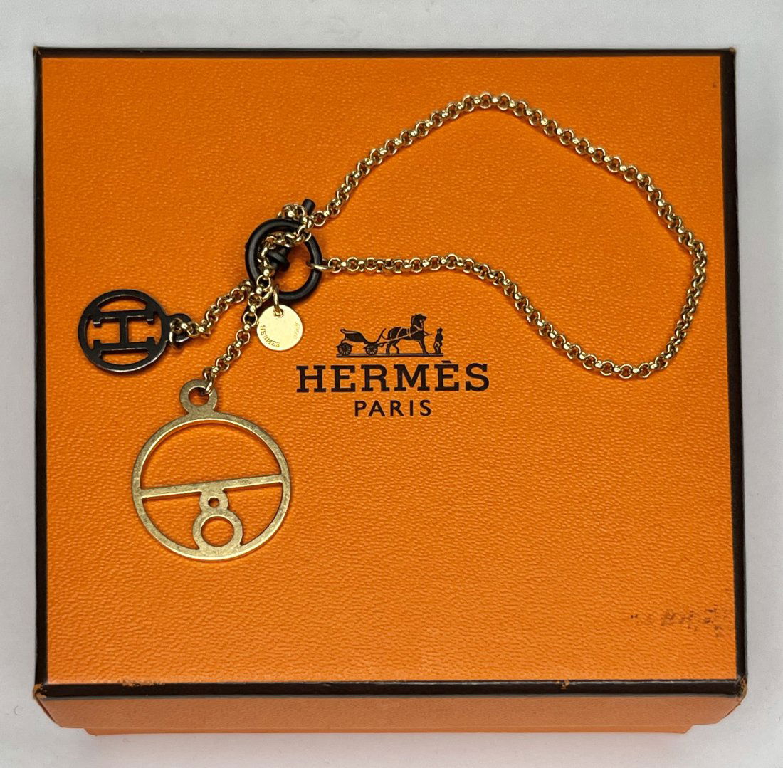Hermes 18k gold and sterling silver bracelet, 4.8 dwts: Hermes 18k gold and sterling silver bracelet, 4.8 dwts.