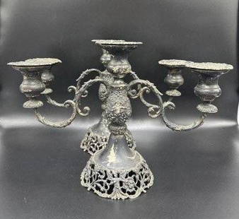 Pair of heavy sterling silver candelabra,1900: Pair of heavy sterling silver candelabra,1900.Total weight: 67 troy ounces.Marked sterling on the bottom with American company mark.