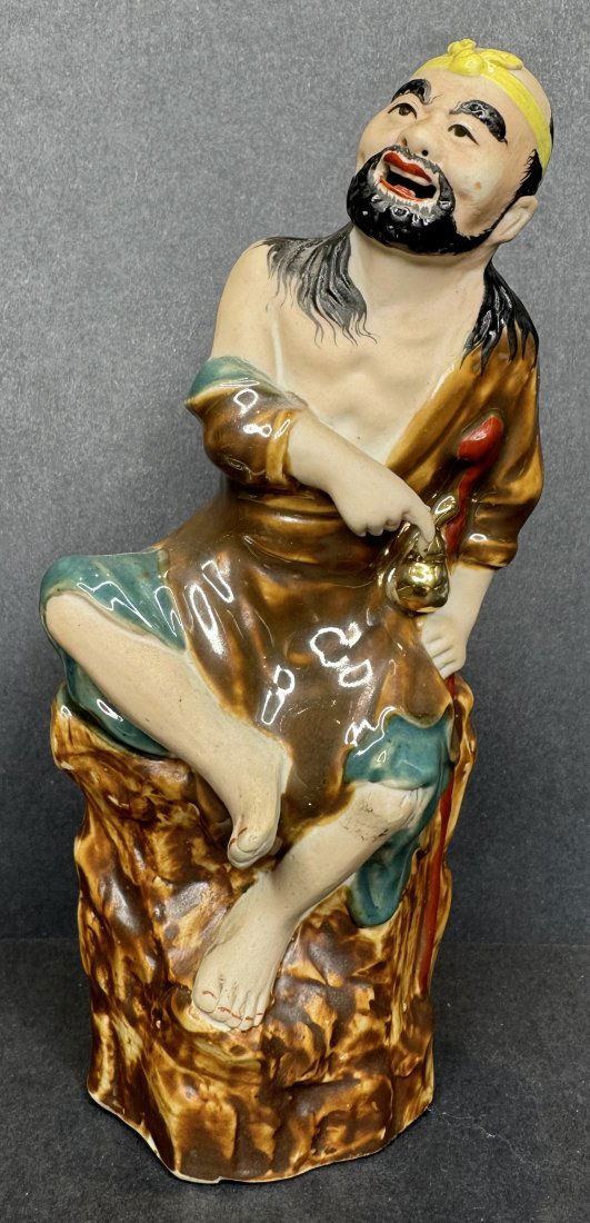 Chinese ceramic figurine of man on rock (1 of 6)
