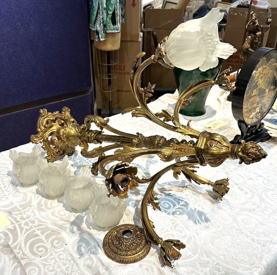 Bronze chandelier with glass shades: Bronze chandelier with glass shades Height is 29" and width is 21"