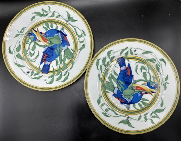 Two Hermes toucan plates 11 inches wide each.: Two Hermes toucan plates.11 inches wide each.