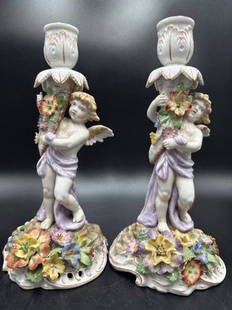 Pair Von Schierholz porcelain angel candle holders: Pair Von Schierholz porcelain angel candle holders Approximate Dimensions: 9.5 inches H, Base 4.75 inches diameter Overall good condition, minor losses to flowers on both