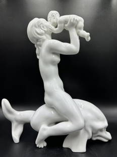 Large B&G figurine of nude riding dolphin: Large Bing and Grondahl figurine of nude riding dolphin Approximate Dimensions: 14.75 inches H by 13 inches W.