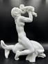 Large B&G figurine of nude riding dolphin