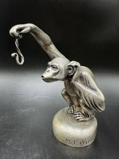 Max LeVerrier (0.54 silver) monkey watch holder: Max LeVerrier (0.54 silver) monkey watch holder. 5.5 inches x 4.5 inches x 3 inches Designed and cast in the 1930s in various forms as a hood ornament, a cigar lighter, a pocket watch stand, etc