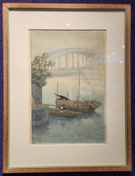 Eitai bridge by Kawase Hasui, woodblock print (creases): Eitai bridge by Kawase Hasui, woodblock print (creases) Approximate Dimensions: 9.75 inches W by 14.5 inches H sight to mat, 16.5 inches W by 21.5 inches H Creases to paper and a small scratch to the 