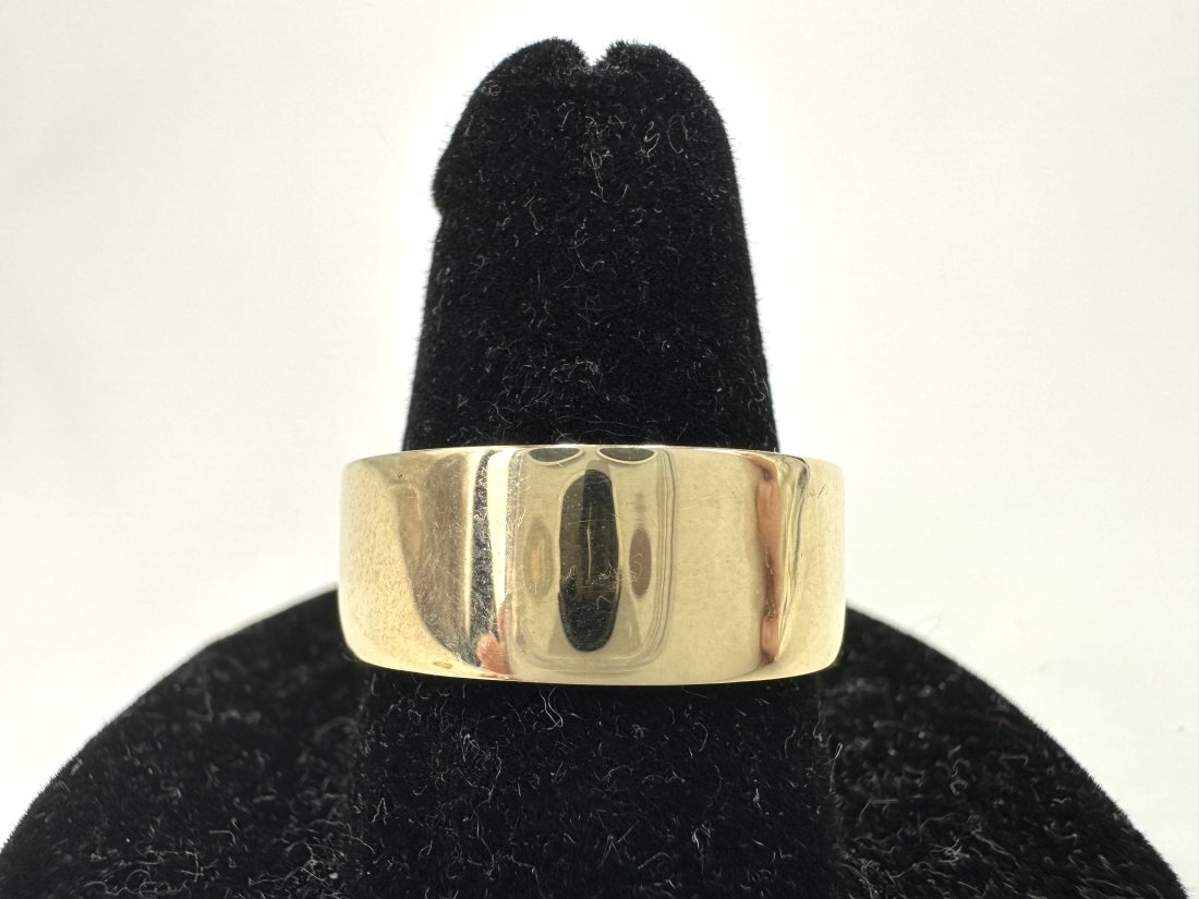 14k gold band, 6.5 dwt, possibly for Tiffany & Co.: 14k gold band, 6.5 dwt Although the band is marked Tiffany, The David Killen Gallery did not believe this was an authentic piece by Tiffany & Co. Size 9.5.---------------------------------------------
