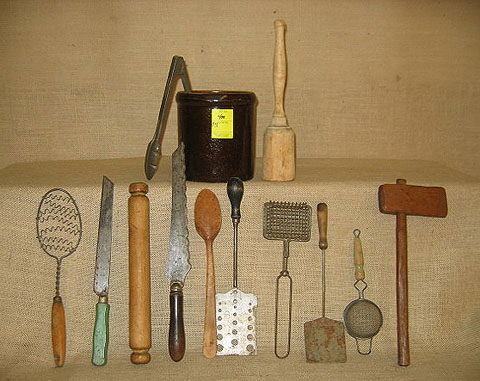 Kitchenware. Brown crock containing kitchen stuff.: Kitchenware. Brown crock containing kitchen stuff. Rollers, graters, spatulas.