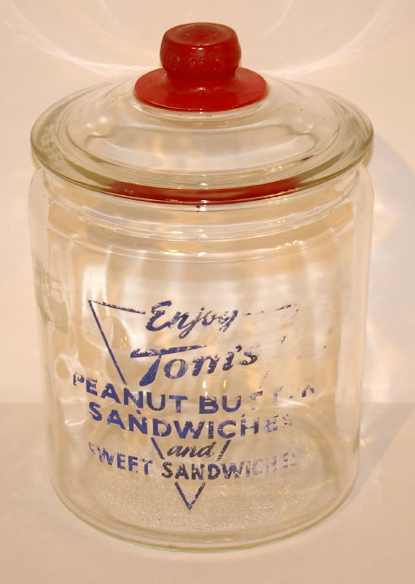 Tom's Glass Countertop Display Peanut Jar: Toms Glass Counter Top Display Reads "Enjoy Tom's Peanut Butter Sandwiches And Sweet Sandwiches." Measures 13 1/2" Tall.