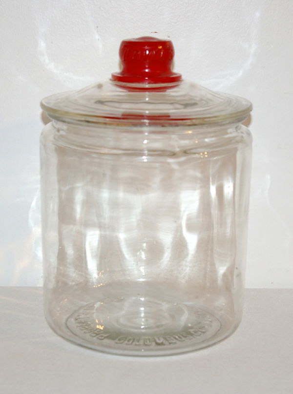 Tom's General Store Glass Peanut Jar: Tom's General Store Glass Peanut Jar. "Property Of Tom Huston Peanut Co. Columbus, GA." Embossed On Bottom Of Jar. Measures 6.5" in Diameter and 10" Tall.