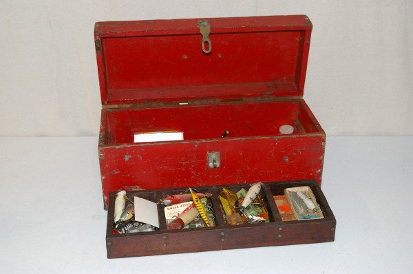 Red Wooden Tackle Box With Fishing Lures: Red Wooden Tackle Box With Assorted Tackle, some lures in the original boxes. Some Lures are modern, some are old, the three hook lures are either modern, or recently restored antique lures, not sure