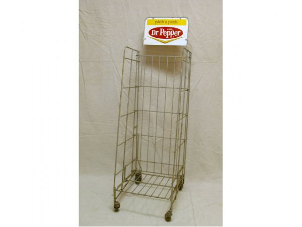 1960s Dr Pepper Chevron Rolling Bottle Rack: 1960s Dr. Pepper Chevron Rolling Bottle Rack. Sign is double-sided. Measures 16" wide x 20-1/2" deep x 54" tall.