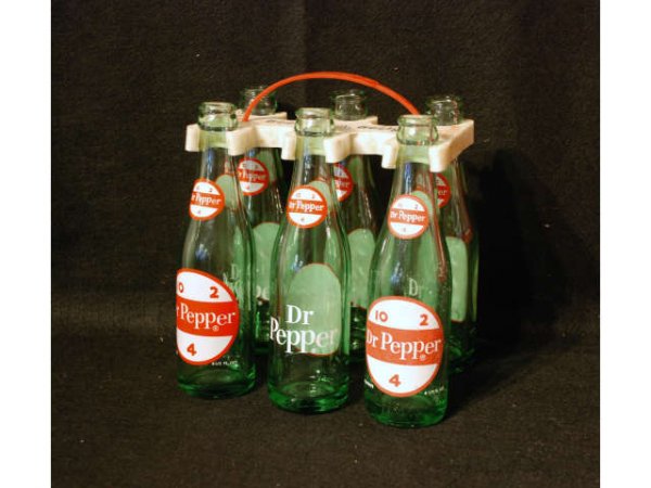 Vintage Dr Pepper Frosty Man Bottle Carrier: Vintage Dr Pepper Frosty Man, Frosty! 6-Pack Bottles and Plastic Carrier. Bottles are 6-1/2" Ounces. Measures 8" wide x 5-3/4" deep x 8-1/4" tall.