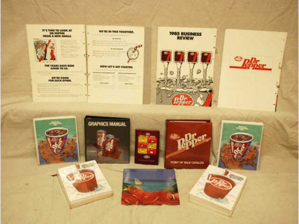 Dr Pepper Salesman Manuals & POS Catalogs: Large Collection Dr Pepper Sales Manuals & Point Of Sales Catalogs. Includes: Three unopened folder packets, Two 1986 International Bottler Calendars; Two 1985 Bottler Marketing Program binder with ma