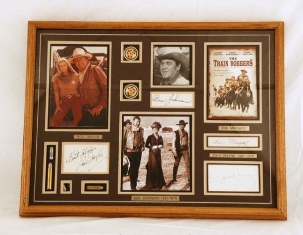 John Wayne Train Robbers Autographs: John Wayne The Train Robbers Cast Autographs & Photos. John Wayne, Rod Taylor, Ben Johnson, Ann Margret Autographs From The Movie The Train Robbers, Nicely Framed. Frame with Certificate of Authentici
