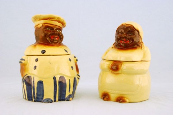Pair of Cooky & Mammy Cookie Jars Black Americana: Chef Cookie Jar ( 10-1/2" H). Unmarked. Mammy Cookie Jar Marked "USA" (9" H). Crazing and chips present.