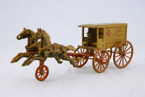 Rare Kenton Horse Drawn 2nd Regiment Ambulance: With Driver and Horse Team. Rare. Paint color is rare. Toy is normally nickel-plated. Measures 16" L.