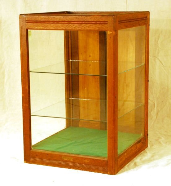 Country Store Countertop Display Case: With 2 glass shelves. Measures 21" W x 21" D x 31-1/2" H.