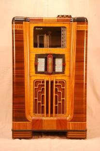 1937 Rock-ola Imperial Jukebox: Rock-ola Art Deco Jukebox. Series B Type IMP2. Serial #30257. With keys and records. Measures 32-1/2 W x 23" D x 52-1/2" H. Was in working order, but has sat for a long time. It is in good condition,