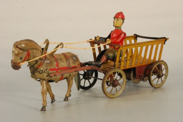 HEN German Trip-Trapp Mule Cart Wind-Up Tin Toy: HEN German Trip-Trapp Mule Cart Wind-Up Tin Toy Bed of cart marked "H E N Trip-Trapp Made in Germany" Measures 5-1/2" H x 11" L. In Working Condition, (P978.101.465)