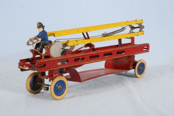 Kingsbury Wind-Up Toy Ladder Fire Truck: Kingsbury Wind-Up Toy Ladder Fire Truck Pressed steel, tin and wood. Measures 7" X 18" (P978.101.372B)
