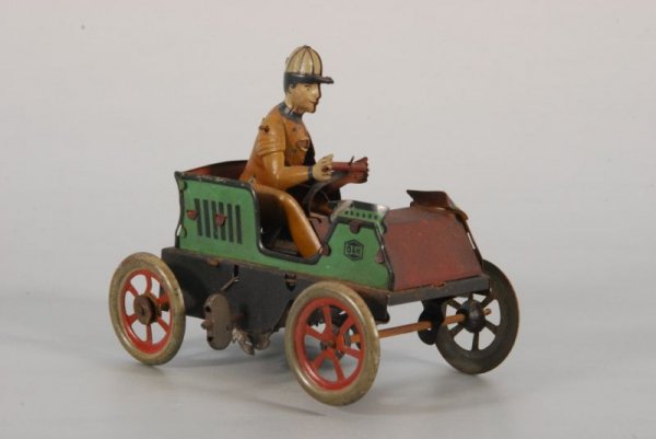 G & K Tin Toy Wind-Up Car & Driver: Marked G & K on side. Measures 4-1/2" L x 3" W x 4" H. (P978.101.537)