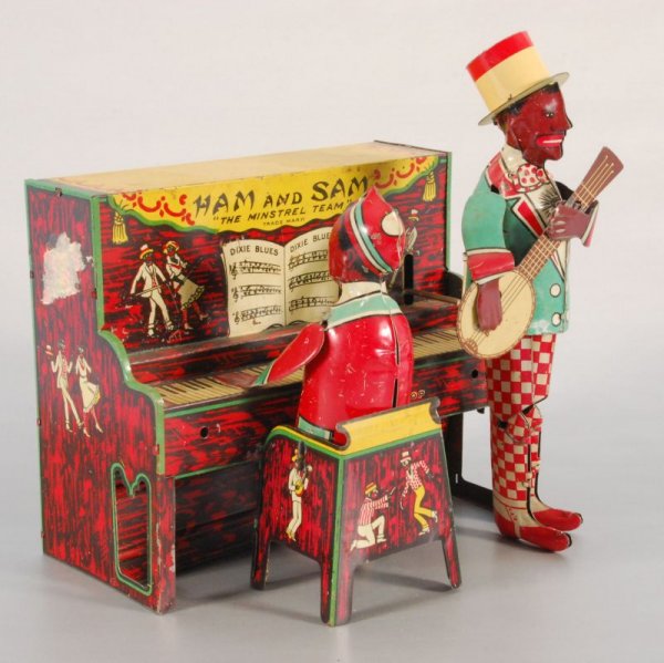 "Ham and Sam" Wind-up Lithographed Tin Toy: Original box is not intact. Mechanism works intermittenly. Measures 8" X 6 1/2" (1978.101.488)