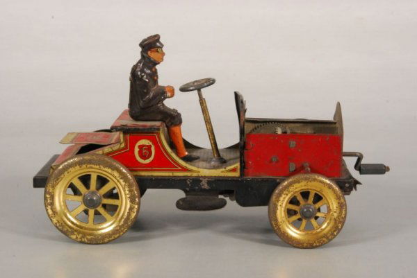 Hill Climber Hessmobil Wind Up Toy Car & Driver: Hessmobil Wind Up Hill Climber Tin Toy Car & Driver. Missing passenger & hood, HJL on trunk lid. 7-1/2" L x 3" W x 4-1/4" Tl. (P978.101.174)