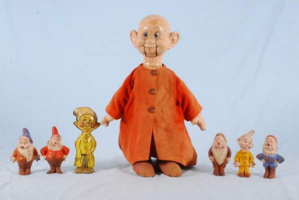 Walt Disney Seven Dwarfs Collection Large Dopey: Includes 5 of The Seven Dwarfs, Bashful, Dopey Sneezy, Happy and Sleepy, Each (6" H ) and Wind Up Seven Dwarfs Character, Measures 8" Tall, (P982.32.13) and Composition Dopey Puppet. Marked "Ideal Dol