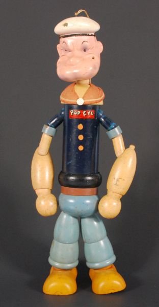 1935 Popeye Wooden Jointed Doll: String Tied, Copyright 1935 by King Feature Syndicate Inc. Complete, Arms need to be re-strung. Measures 14" L. (P978.101.515)