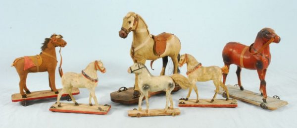 Collection of 6 Antique Horse Pull Toys: Collection of 6 Antique Horse Pull Toys. Includes papier mache and composite. Largest measures 11-1/4" H. (P978.101.632-635; 119; 2154).