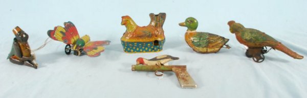 Collection of 6 Tin Animal Toys: Includes Baldwin Laying Hen, Chein Monkey, Lehman Tock-Tock Duck and Butterfly, Whooper Bird Woodpecker and German Parrot. (P978.101.2136, 531, 109, 555, 692).