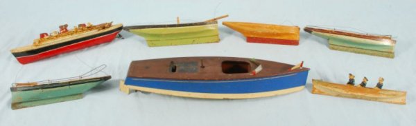 Collection of 7 Antique Toy Boats: 6 Wooden and 1 Tin. Largest measures 18" L. (P978.101.704; 706; 701; 57; 702; 703).
