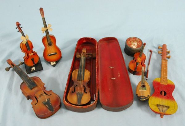Collection Of 7 Vintage Toy Instruments: Collection of 7 toy instruments, plus 1 tin string canister.